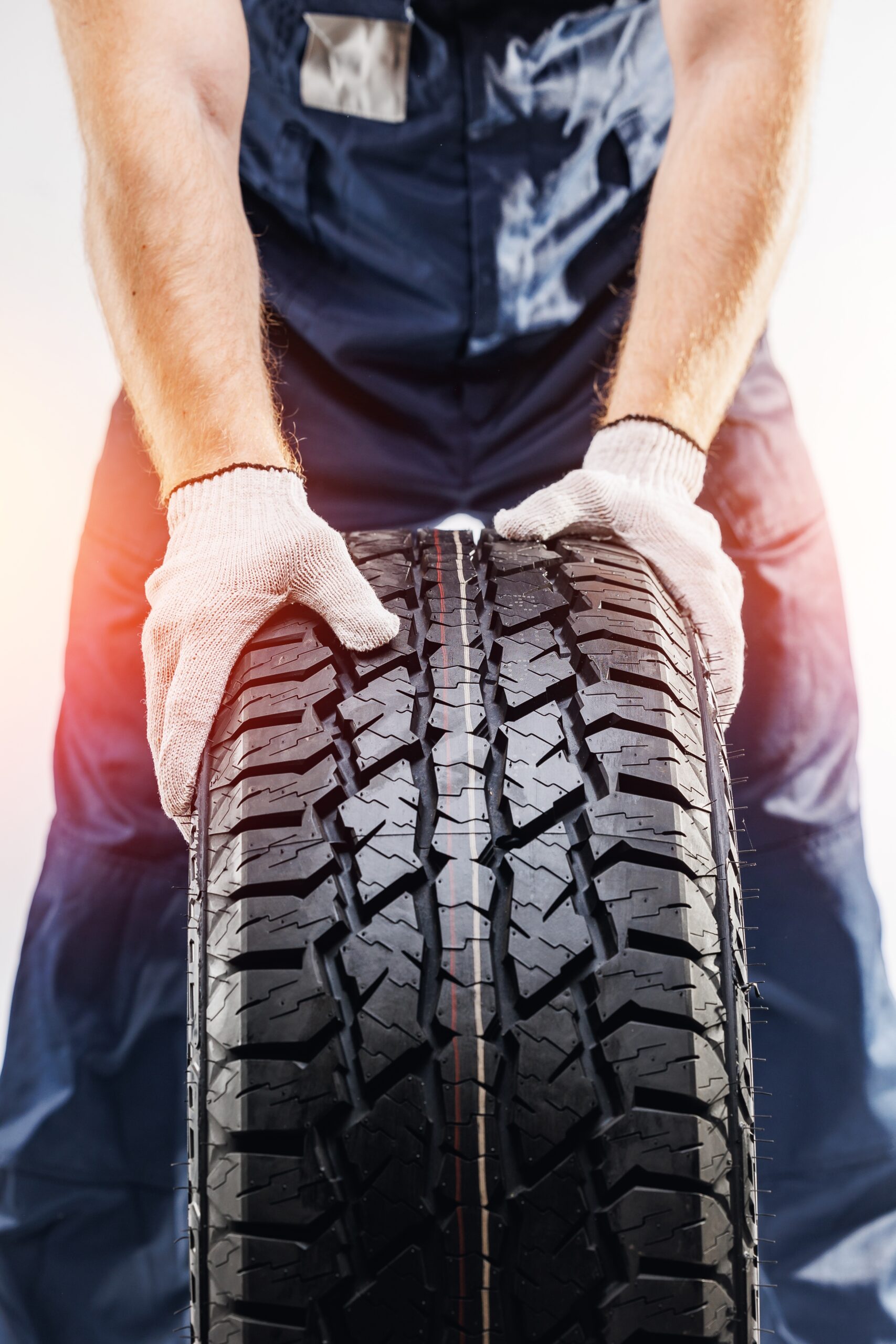 An image showing a person holding a tyre